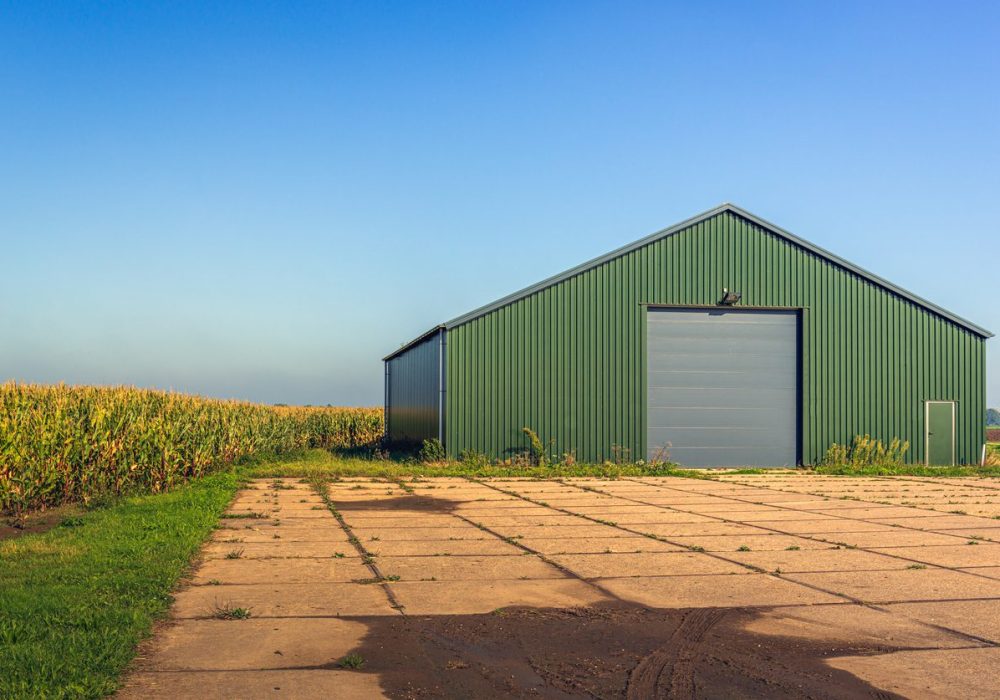 Modern agricultural barn with a yard of concrete slabs
