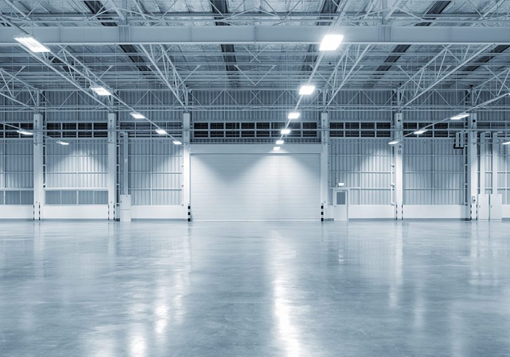 Factory building or warehouse building with concrete floor for industry background.